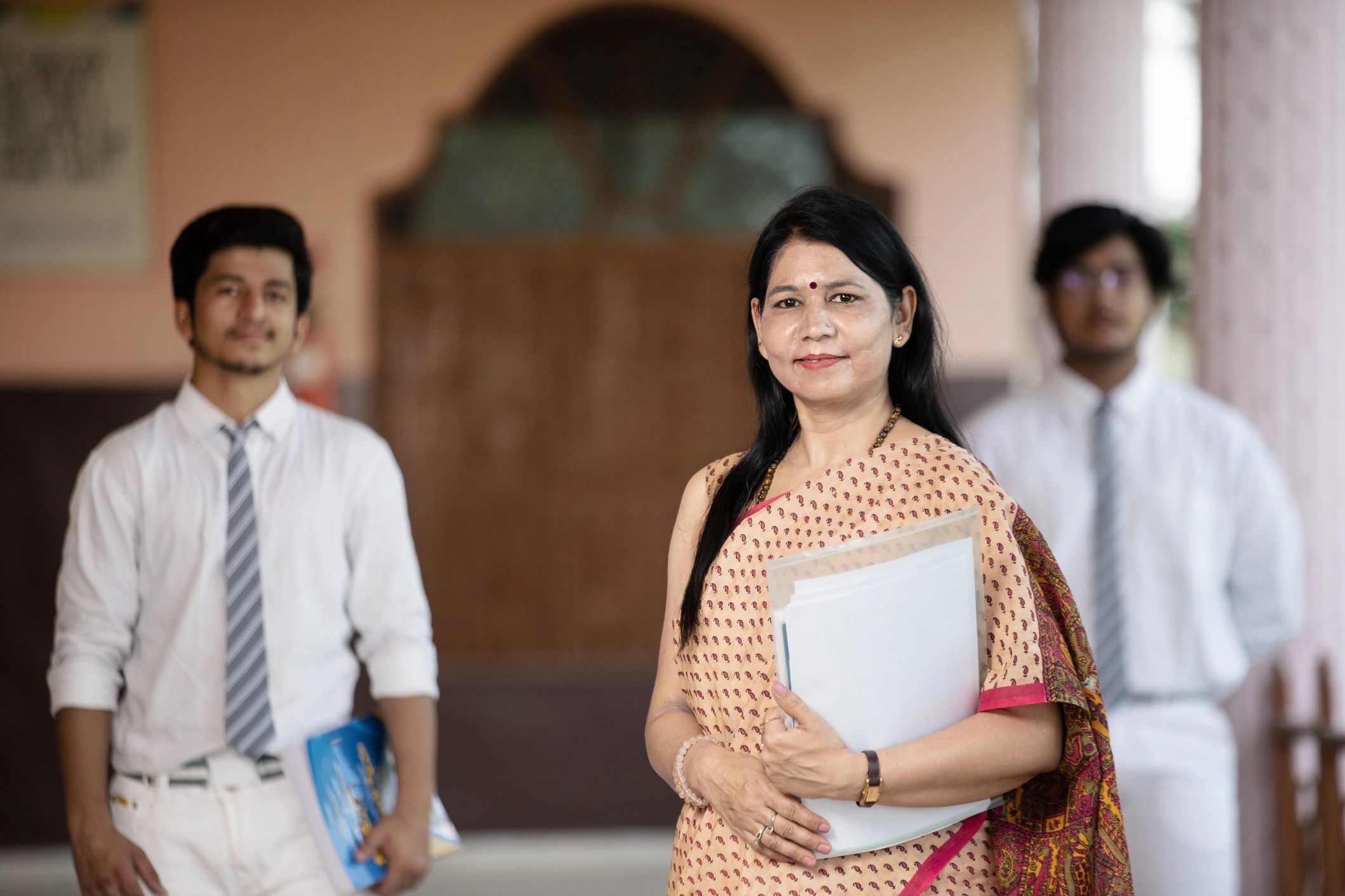 Teacher with students in the background